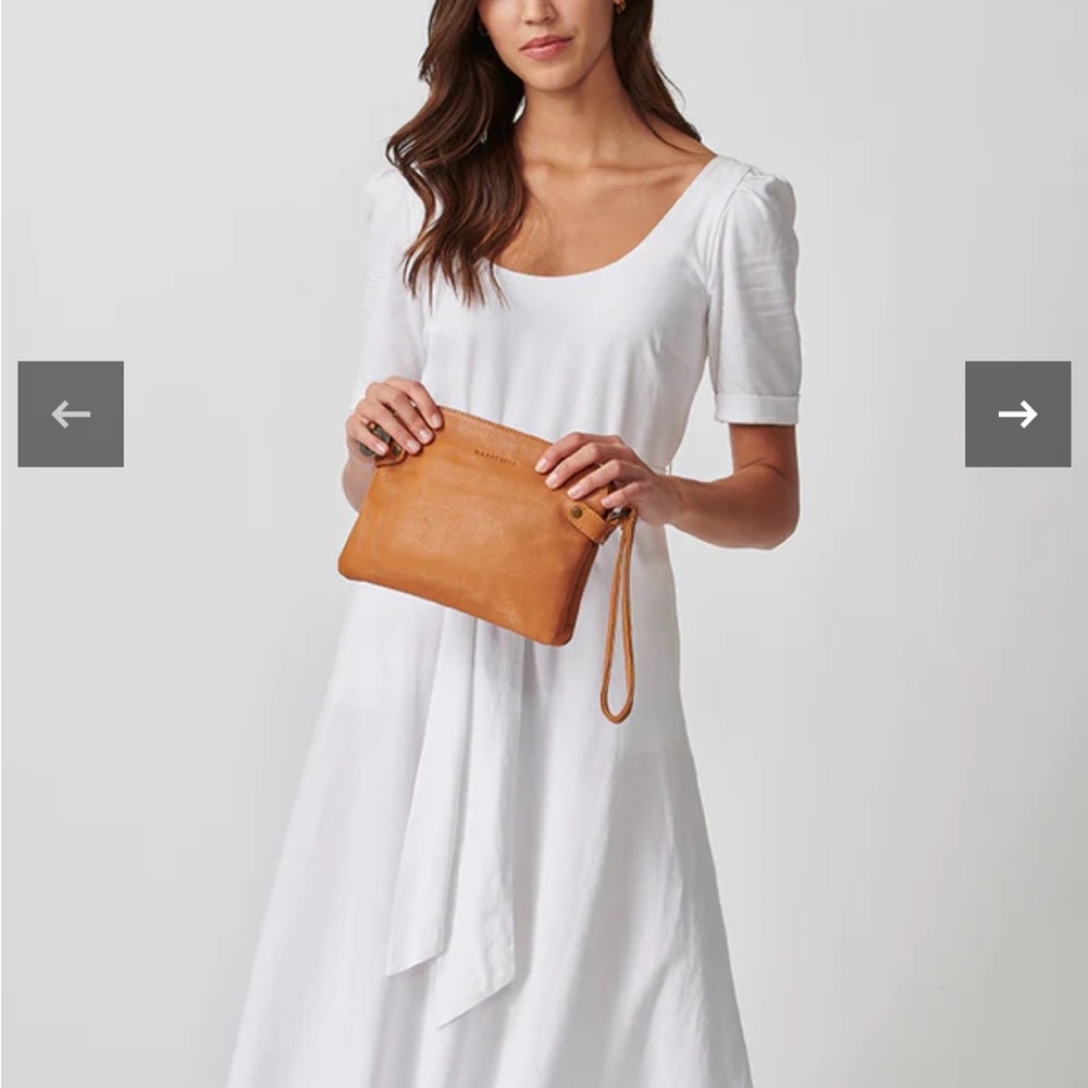 The Venetian Passport by Wanderers travel company. Color: Classic tan.